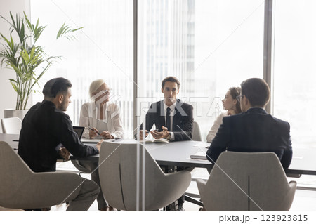 Modern effective young business leader gather diverse staff for briefing Modern effective young business leader gather diverse staff for briefing 123923815