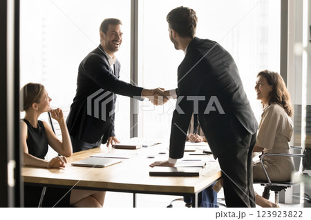 Businessmen shaking hands, establish strategic alliance between two companies 123923822