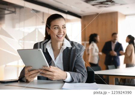 Happy young manager woman using tablet in office co-working Happy young manager woman using tablet in office co-working 123924390
