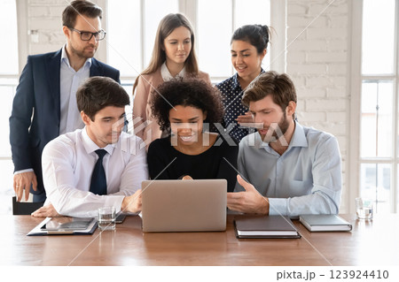 Multinational staff members gathered together for joint project discussion 123924410