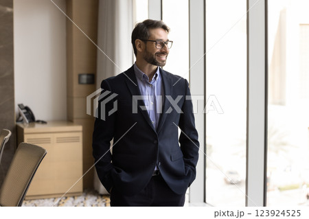 Pensive middle-aged Portuguese businessman professional posing in boardroom Pensive middle-aged Portuguese businessman professional posing in boardroom 123924525
