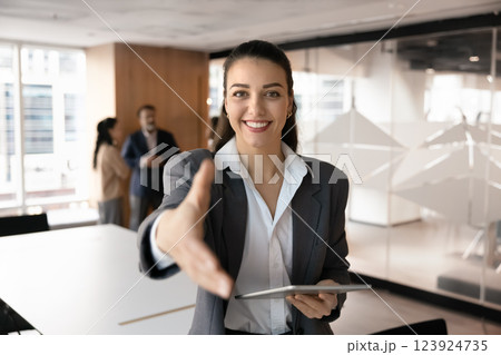 Cheerful young recruit manager woman offering hiring in successful company Cheerful young recruit manager woman offering hiring in successful company 123924735