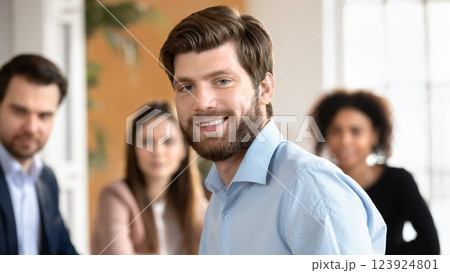 Team leader close up portrait, teammates on background 123924801