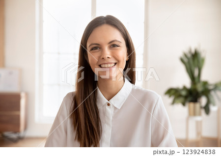 Young woman online telemeeting participant looking at camera 123924838