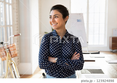 Young Indian businesswoman posing in modern creative office 123924898