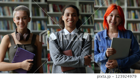 Smiling multiethnic students looking at camera posing in library 123924979