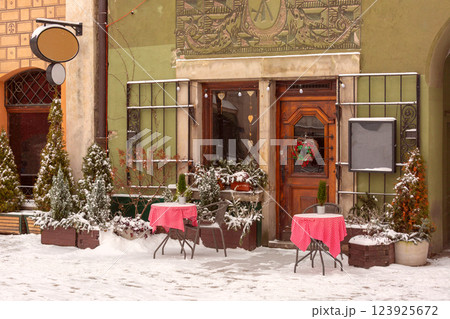 Snowy Cafe Entrance in Old Town Poznan, Poland Snowy Cafe Entrance in Old Town Poznan, Poland 123925672