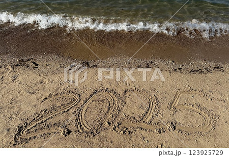Year 2025 Written in Sand. Christmas Year 2025 Written in Sand. Christmas 123925729