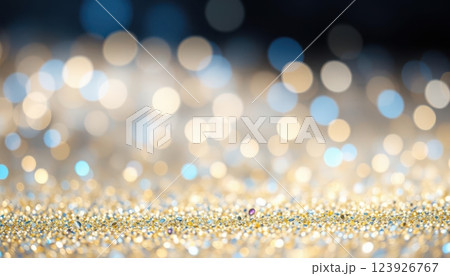 a close up of a gold glitter background with a blurry background 123926767