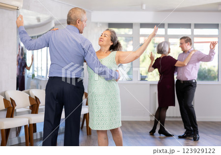 Elderly man and elderly woman dance waltz 123929122