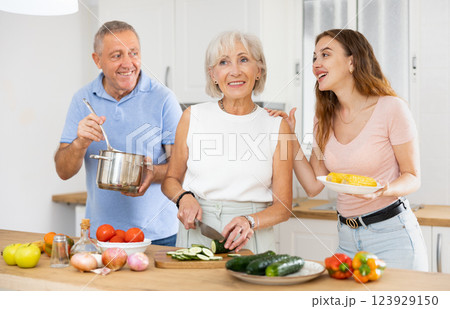 Happy family in the kitchen having fun Happy family in the kitchen having fun 123929150