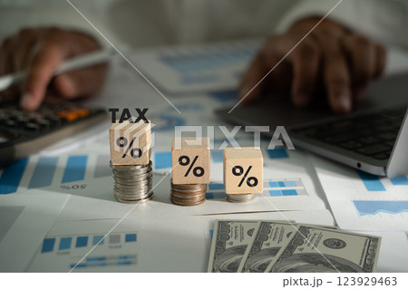Concept of house and property tax business and finance involves money, investment, taxation, and banking. Success depends on profit, revenue, budgeting, and economic growth. 123929463