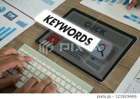 keywords on a website for content businessman Search keywords on a laptop, browse in the office, optimize SEO engine communication on the computer, find data analysis, and advertise on the internet. 123929469