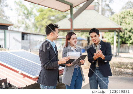 Sustainable business. Professionals examining potential solar solutions outdoors. 123929881