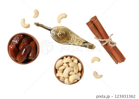 PNG, Ramadan. Golden lamp with dates, cinnamon and cashews, isolated on white background. 123931362