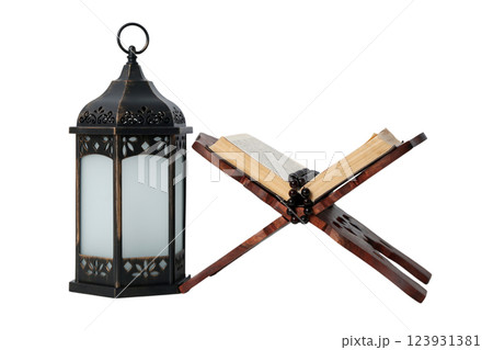 PNG, Ramadan. Quran book on a stand with a lantern, isolated on a white background. PNG, Ramadan. Quran book on a stand with a lantern, isolated on a white background. 123931381