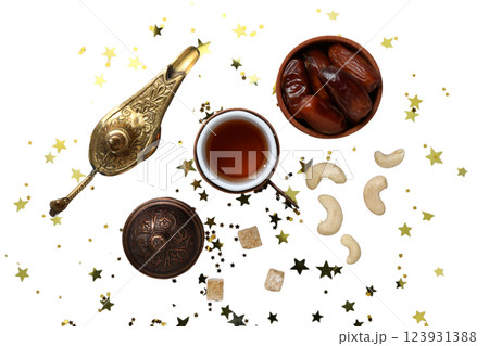 PNG, Ramadan. Dates, cashews with a cup of tea and a lamp, isolated on a white background. PNG, Ramadan. Dates, cashews with a cup of tea and a lamp, isolated on a white background. 123931388