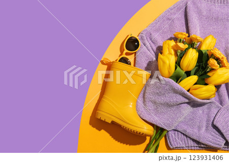 Hello spring, sweater, boots, bouquet and sunglasses on a purple background, top view, space for text Hello spring, sweater, boots, bouquet and sunglasses on a purple background, top view, space for text 123931406