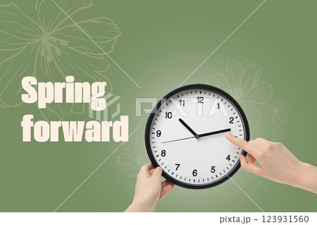 Spring Forward. Hands holding a clock, on a green background, with text. Spring Forward. Hands holding a clock, on a green background, with text. 123931560
