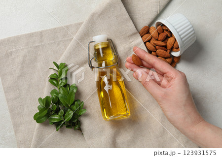 Skin care and body care concept - almonds, almond oil 123931575