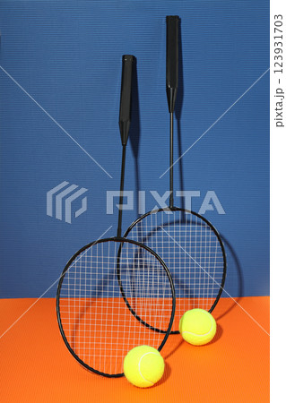 Two rackets for tennis on a blue background Two rackets for tennis on a blue background 123931703