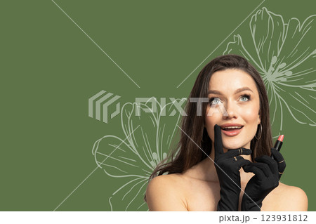 8 March, international women's day, surprised happy woman in black gloves and with lipstick in her hands on a green background, with space for text 123931812