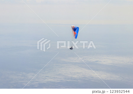 Paragliders in blue sky. Concept of active lifestyle and extreme sport adventure Paragliders in blue sky. Concept of active lifestyle and extreme sport adventure 123932544