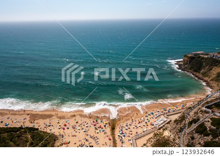 Aerial view of Magoito Beach with tourists and Aerial view of Magoito Beach with tourists and 123932646