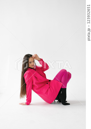 Empowered Woman Posing In Pink Attire 123932651