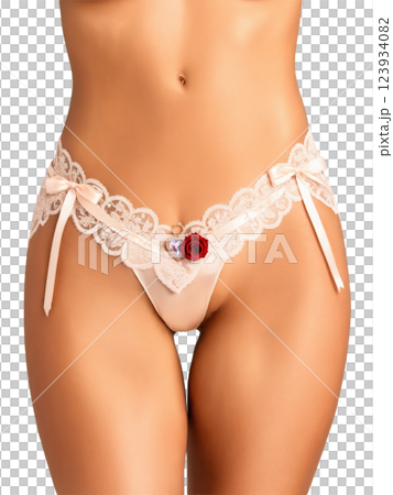 A satin silk garter with lace trim and a small heart-shaped rose quartz pendant, designed to add a personal, romantic A satin silk garter with lace trim and a small heart-shaped rose quartz pendant, designed to add a personal, romantic 123934082