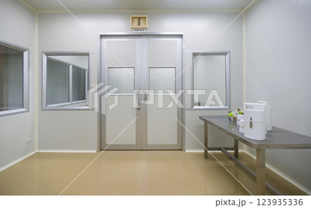Clean room environment with controlled access door and minimalistic design for laboratory activity Clean room environment with controlled access door and minimalistic design for laboratory activity 123935336