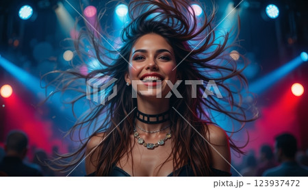 Young Rocker in Ecstasy Portrait of a Girl Shaking Her Hair at a Concert 123937472