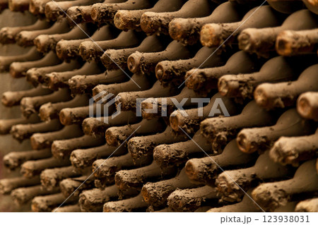 Old bottles of wine stacked in rows Old bottles of wine stacked in rows 123938031