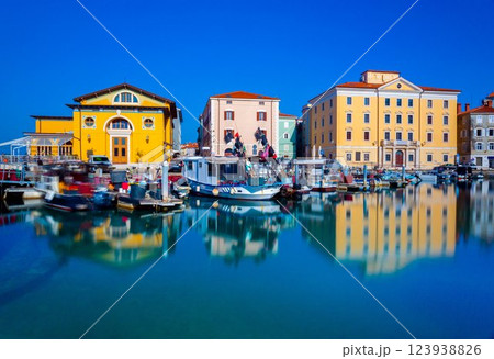 Cityscape of Piran mirrored in water. Old Slovenian town on the Adriatic Sea 123938826