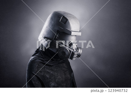 Man with helmet over dark misty background 123940732