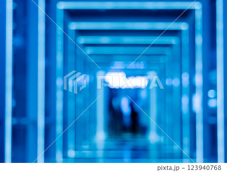 Blue blurred tunnel neon lights futuristic abstract background Blue blurred tunnel neon lights futuristic abstract background 123940768