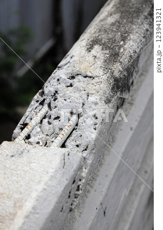 Cracked grey concrete surface with visible reinforcement, Rust in reinforcement of Concrete bridge, Broken or weak concrete. 123941321