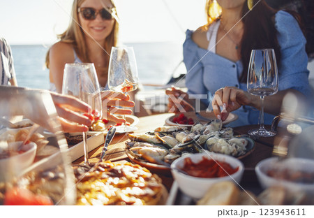 Mock up of large bottle of champagne made of dark glass. Empty black sticker. Chilled bottle of wine in the hands of the waiter. Holiday concept 123943611