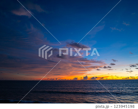 Aerial view of Vibrant Sunset Over Ocean Waves Aerial view of Vibrant Sunset Over Ocean Waves 123945198
