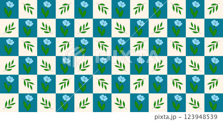 Seamless checkered pattern with blue flowers and green leaves on checked yellow blue background 123948539
