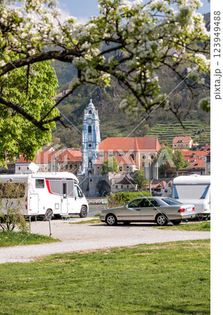Durnstein village with church against camping area next to the Danube river during spring time in Wachau, Austria 123949488