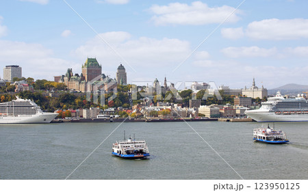 Quebec City skyline in autumn with two ferries crossing Saint Lawrence River in autumn Quebec City skyline in autumn with two ferries crossing Saint Lawrence River in autumn 123950125