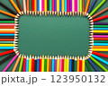 wreath of multicolored pencils on green chalkboard background, top view, copy space, back to school concept 123950132
