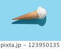 vanilla ice cream and hard shadow on blue background, creative decoration of minimal summer concept 123950135