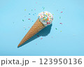 top view of ice cream cone and strewed sprinkles on blue with hard shadow, minimal  summer concept 123950136