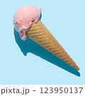 top view of pink ice cream cone with hard shadow isolated on blue, minimal summer concept 123950137