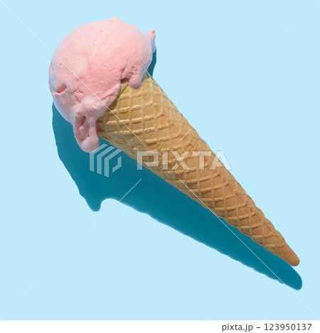 top view of pink ice cream cone with hard shadow isolated on blue, minimal summer concept 123950137