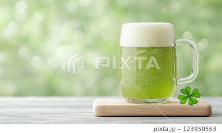Refreshing green beer on wooden board with clover in sunlit background. St Patrick's. 123950563