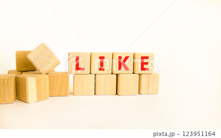 Like symbol. Concept word Like on beautiful wooden blocks. Beautiful white table white background. Business, lifestyle, support and like concept. Copy space. 123951164