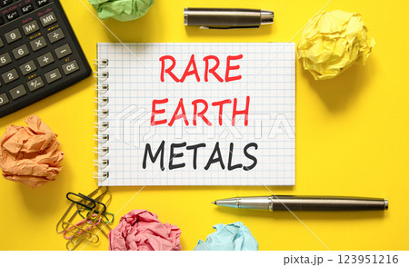 Rare earth metals symbol. Concept words Rare earth metals on beautiful white note. Black pen. Calculator. Beautiful yellow background. Business and rare earth metals concept. Copy space. Rare earth metals symbol. Concept words Rare earth metals on beautiful white note. Black pen. Calculator. Beautiful yellow background. Business and rare earth metals concept. Copy space. 123951216